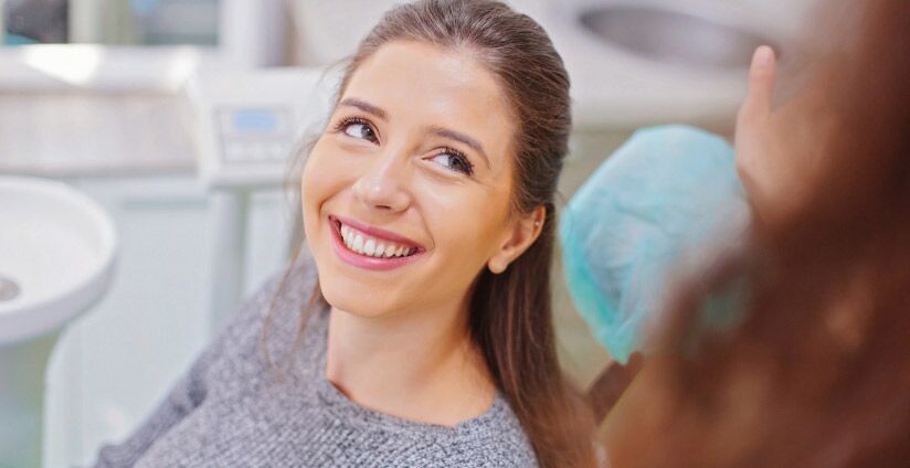 Beautiful Positive Young Woman Smiling Broadly After Regular Dental Checkup In Hamilton, Ontario At Sagewood Dental Care